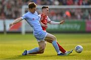 29 April 2022; Cameron McJannet of Derry City in action against Darragh Burns of St Patrick's Athletic during the SSE Airtricity League Premier Division match between St Patrick's Athletic and Derry City at Richmond Park in Dublin. Photo by Seb Daly/Sportsfile