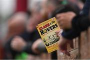 29 April 2022; A supporter holds a match programme during the SSE Airtricity League Premier Division match between Sligo Rovers and Shamrock Rovers at The Showgrounds in Sligo. Photo by Piaras Ó Mídheach/Sportsfile