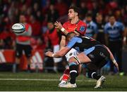 29 April 2022; Joey Carbery of Munster offloads posessesion before tackled by Matthew Screech of Cardiff Blues during the United Rugby Championship match between Munster and Cardiff at Musgrave Park in Cork. Photo by Sam Barnes/Sportsfile