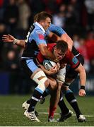 29 April 2022; Alex Kendellen of Munster is tackled by Garyn Smith, left, and Matthew Screech of Cardiff Blues during the United Rugby Championship match between Munster and Cardiff at Musgrave Park in Cork. Photo by Sam Barnes/Sportsfile