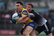 30 April 2022; Conor Hussey of Roscommon is tackled by Sean Carrabine of Sligo during the Connacht GAA Football Senior Championship Semi-Final match between Roscommon and Sligo at Markievicz Park in Sligo. Photo by Brendan Moran/Sportsfile