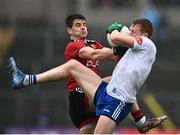 30 April 2022; Micheál Bannigan of Monaghan in action against Odhran Murdock of Down during the Ulster GAA Football Senior Championship Quarter-Final match between Monaghan and Down at St Tiernach’s Park in Clones, Monaghan. Photo by David Fitzgerald/Sportsfile