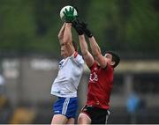 30 April 2022; Micheál Bannigan of Monaghan in action against Odhran Murdock of Down during the Ulster GAA Football Senior Championship Quarter-Final match between Monaghan and Down at St Tiernach’s Park in Clones, Monaghan. Photo by David Fitzgerald/Sportsfile