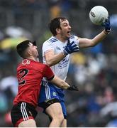 30 April 2022; Jack McCarron of Monaghan in action against Peter Fegan of Down during the Ulster GAA Football Senior Championship Quarter-Final match between Monaghan and Down at St Tiernach’s Park in Clones, Monaghan. Photo by David Fitzgerald/Sportsfile