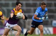 30 April 2022; Paidí Hughes of Wexford in action against Jonny Cooper of Dublin during the Leinster GAA Football Senior Championship Quarter-Final match between Wexford and Dublin at Chadwicks Wexford Park in Wexford. Photo by Ray McManus/Sportsfile