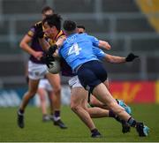 30 April 2022; Paidí Hughes of Wexford in action against Lee Gannon of Dublin during the Leinster GAA Football Senior Championship Quarter-Final match between Wexford and Dublin at Chadwicks Wexford Park in Wexford. Photo by Ray McManus/Sportsfile