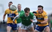 30 April 2022; Brian Donovan of Limerick in action against Eoghan Collins of Clare during the Munster GAA Senior Football Championship Quarter-Final match between Clare and Limerick at Cusack Park in Ennis, Clare. Photo by Piaras Ó Mídheach/Sportsfile