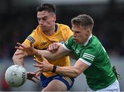 30 April 2022; Jamie Malone of Clare in action against Cillian Fahy of Limerick during the Munster GAA Senior Football Championship Quarter-Final match between Clare and Limerick at Cusack Park in Ennis, Clare. Photo by Piaras Ó Mídheach/Sportsfile