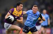 30 April 2022; Paidí Hughes of Wexford in action against Ciarán Kilkenny of Dublin during the Leinster GAA Football Senior Championship Quarter-Final match between Wexford and Dublin at Chadwicks Wexford Park in Wexford. Photo by Ray McManus/Sportsfile