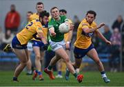 30 April 2022; Hugh Bourke of Limerick in action against Clare players Manus Doherty, left, and Cian O'Dea during the Munster GAA Senior Football Championship Quarter-Final match between Clare and Limerick at Cusack Park in Ennis, Clare. Photo by Piaras Ó Mídheach/Sportsfile