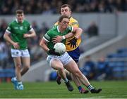 30 April 2022; Peter Nash of Limerick in action against Ciarán Russell of Clare during the Munster GAA Senior Football Championship Quarter-Final match between Clare and Limerick at Cusack Park in Ennis, Clare. Photo by Piaras Ó Mídheach/Sportsfile