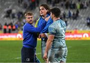 30 April 2022; Player of the match Alex Soroka of Leinster wears a Ukranian flag as he is consoled by teammates David Hawkshaw and Thomas Clarkson after the United Rugby Championship match between DHL Stormers and Leinster at the DHL Stadium in Cape Town, South Africa. Photo by Harry Murphy/Sportsfile