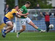 30 April 2022; Cillian Fahy of Limerick takes a shot under pressure from David Tubridy of Clare during the Munster GAA Senior Football Championship Quarter-Final match between Clare and Limerick at Cusack Park in Ennis, Clare. Photo by Piaras Ó Mídheach/Sportsfile