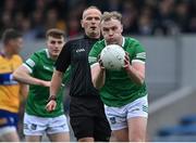 30 April 2022; Referee Conor Lane watches as Adrian Enright of Limerick goes on the attack during the Munster GAA Senior Football Championship Quarter-Final match between Clare and Limerick at Cusack Park in Ennis, Clare. Photo by Piaras Ó Mídheach/Sportsfile