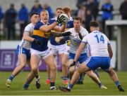 30 April 2022; Teddy Doyle of Tipperary in action against Waterford players, from left, Darragh Corcoran, Jason Curry and Tom O’Connell during the Munster GAA Senior Football Championship Quarter-Final match between Waterford and Tipperary at Fraher Field in Dungarvan, Waterford. Photo by Seb Daly/Sportsfile