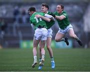 30 April 2022; James Naughton of Limerick, celebrates with team-mates Brian Donovan, left, and Peter Nash, right, after scoring the winning penalty in the penalty shoot-out of the Munster GAA Senior Football Championship Quarter-Final match between Clare and Limerick at Cusack Park in Ennis, Clare. Photo by Piaras Ó Mídheach/Sportsfile