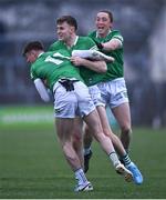 30 April 2022; James Naughton of Limerick, celebrates with team-mates Brian Donovan, left, and Peter Nash, right, after scoring the winning penalty in the penalty shoot-out of the Munster GAA Senior Football Championship Quarter-Final match between Clare and Limerick at Cusack Park in Ennis, Clare. Photo by Piaras Ó Mídheach/Sportsfile