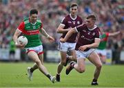 24 April 2022; Conor Loftus of Mayo in action against Jack Glynn of Galway during the Connacht GAA Football Senior Championship Quarter-Final match between Mayo and Galway at Hastings Insurance MacHale Park in Castlebar, Mayo. Photo by Brendan Moran/Sportsfile