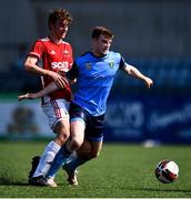 26 April 2022; Ciaran Behan of UCD and Dan Mairs of Queen's University Belfast during the Collingwood Cup Final match between UCD and Queens University Belfast at Oriel Park in Dundalk, Louth. Photo by Ben McShane/Sportsfile