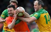 24 April 2022; Aidan Forker of Armagh is tackled by Michael Murphy of Donegal during the Ulster GAA Football Senior Championship Quarter-Final match between Donegal and Armagh at Páirc MacCumhaill in Ballybofey, Donegal. Photo by Ramsey Cardy/Sportsfile
