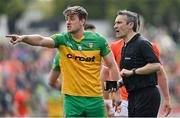 24 April 2022; Referee Maurice Deegan and Hugh McFadden of Donegal during the Ulster GAA Football Senior Championship Quarter-Final match between Donegal and Armagh at Páirc MacCumhaill in Ballybofey, Donegal. Photo by Ramsey Cardy/Sportsfile