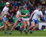 27 April 2022; Eddie Stokes of Limerick in action against Mark Fitzgerald of Waterford during the oneills.com Munster GAA Hurling U20 Championship Semi-Final match between Limerick and Waterford at TUS Gaelic Grounds in Limerick, Ireland. Photo by Michael P Ryan/Sportsfile