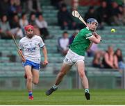 27 April 2022; Eddie Stokes of Limerick in action against Seamus Fitzgerald of Waterford during the oneills.com Munster GAA Hurling U20 Championship Semi-Final match between Limerick and Waterford at TUS Gaelic Grounds in Limerick, Ireland. Photo by Michael P Ryan/Sportsfile