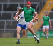 27 April 2022; Colin Coughlan of Limerick in action against Seanie Callaghan of Waterford during the oneills.com Munster GAA Hurling U20 Championship Semi-Final match between Limerick and Waterford at TUS Gaelic Grounds in Limerick, Ireland. Photo by Michael P Ryan/Sportsfile