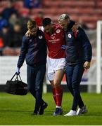 29 April 2022; Ronan Coughlan of St Patrick's Athletic is helped from the pitch following an injury during the SSE Airtricity League Premier Division match between St Patrick's Athletic and Derry City at Richmond Park in Dublin. Photo by Seb Daly/Sportsfile