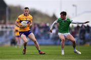 30 April 2022; Ciarán Russell of Clare in action against Brian Donovan of Limerick during the Munster GAA Senior Football Championship Quarter-Final match between Clare and Limerick at Cusack Park in Ennis, Clare. Photo by Piaras Ó Mídheach/Sportsfile