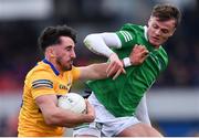 30 April 2022; Aaron Griffin of Clare in action against Brian Donovan of Limerick during the Munster GAA Senior Football Championship Quarter-Final match between Clare and Limerick at Cusack Park in Ennis, Clare. Photo by Piaras Ó Mídheach/Sportsfile