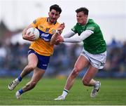 30 April 2022; Aaron Griffin of Clare in action against Brian Donovan of Limerick during the Munster GAA Senior Football Championship Quarter-Final match between Clare and Limerick at Cusack Park in Ennis, Clare. Photo by Piaras Ó Mídheach/Sportsfile