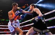 30 April 2022; Katie Taylor, right, and Amanda Serrano during their undisputed world lightweight championship fight at Madison Square Garden in New York, USA. Photo by Stephen McCarthy/Sportsfile