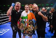 30 April 2022; Katie Taylor with manager Brian Peters, left, and coach Ross Enamait, right, after her undisputed world lightweight championship fight with Amanda Serrano at Madison Square Garden in New York, USA. Photo by Stephen McCarthy/Sportsfile