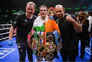 30 April 2022; Katie Taylor with manager Brian Peters, left, and coach Ross Enamait, right, after her undisputed world lightweight championship fight with Amanda Serrano at Madison Square Garden in New York, USA. Photo by Stephen McCarthy/Sportsfile