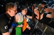 30 April 2022; Katie Taylor and manager Brian Peters, left, take a selfie with a supporter after her undisputed world lightweight championship fight with Amanda Serrano at Madison Square Garden in New York, USA. Photo by Stephen McCarthy/Sportsfile