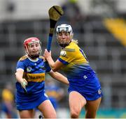 1 May 2022; Eimear Kelly of Clare is tackled by Aoife McGrath of Tipperary during the Munster Senior Camogie Championship Semi-Final match between Clare and Tipperary at FBD Semple Stadium in Thurles, Tipperary. Photo by Ray McManus/Sportsfile