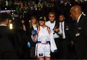 30 April 2022; Amanda Serrano accompanied by promoter Jake Paul walks to the ring for her undisputed world lightweight championship fight with Katie Taylor at Madison Square Garden in New York, USA. Photo by Stephen McCarthy/Sportsfile