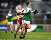 1 May 2022; Aisling O'Brien of Fermanagh in action against Nuala Browne of Derry during the Ulster Ladies Football Junior Championship Semi Final match between Derry and Fermanagh at O'Neills Healy Park in Omagh, Tyrone. Photo by David Fitzgerald/Sportsfile