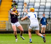 1 May 2022; Conor McDonald of Wexford shoots to score his side's first goal past Laois goalkeeper Enda Rowland during the Leinster GAA Hurling Senior Championship Round 3 match between Laois and Wexford at MW Hire O’Moore Park in Portlaoise, Laois. Photo by Michael P Ryan/Sportsfile
