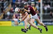 1 May 2022; Michael Carey of Kilkenny is tackled by Joseph Cooney of Galway during the Leinster GAA Hurling Senior Championship Round 3 match between Galway and Kilkenny at Pearse Stadium in Galway. Photo by Brendan Moran/Sportsfile