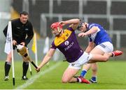 1 May 2022; Lee Chin of Wexford is tackled by Liam O'Connell of Laois during the Leinster GAA Hurling Senior Championship Round 3 match between Laois and Wexford at MW Hire O’Moore Park in Portlaoise, Laois. Photo by Michael P Ryan/Sportsfile
