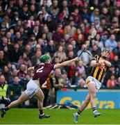 1 May 2022; Eoin Cody of Kilkenny scores a point despite the eforts of Jack Grealish of Galway during the Leinster GAA Hurling Senior Championship Round 3 match between Galway and Kilkenny at Pearse Stadium in Galway. Photo by Brendan Moran/Sportsfile