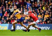 1 May 2022; Peter Duggan of Clare is tackled by Ciarán Joyce of Cork during the Munster GAA Hurling Senior Championship Round 3 match between Cork and Clare at FBD Semple Stadium in Thurles, Tipperary. Photo by Ray McManus/Sportsfile