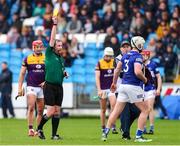 1 May 2022; Ciaran McEvoy of Laois is shown a yellow card by referee Colum Cunning during the Leinster GAA Hurling Senior Championship Round 3 match between Laois and Wexford at MW Hire O’Moore Park in Portlaoise, Laois. Photo by Michael P Ryan/Sportsfile