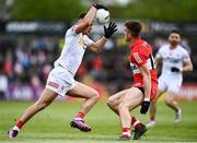 1 May 2022; Michael McKernan of Tyrone in action against Shane McGuigan of Derry during the Ulster GAA Football Senior Championship Quarter-Final match between Tyrone and Derry at O'Neills Healy Park in Omagh, Tyrone. Photo by David Fitzgerald/Sportsfile
