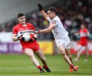 1 May 2022; Padraig McGrogan of Derry in action against Kieran McGeary of Tyrone during the Ulster GAA Football Senior Championship Quarter-Final match between Tyrone and Derry at O'Neills Healy Park in Omagh, Tyrone. Photo by David Fitzgerald/Sportsfile