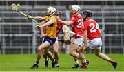 1 May 2022; Ryan Taylor of Clare is tackled by Tommy O’Connell, Niall O’Leary and Conor Lehane of Cork during the Munster GAA Hurling Senior Championship Round 3 match between Cork and Clare at FBD Semple Stadium in Thurles, Tipperary. Photo by Ray McManus/Sportsfile