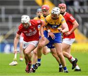 1 May 2022; Patrick Horgan of Cork is tackled by Conor Cleary of Clare during the Munster GAA Hurling Senior Championship Round 3 match between Cork and Clare at FBD Semple Stadium in Thurles, Tipperary. Photo by Ray McManus/Sportsfile