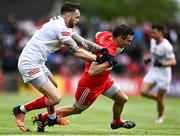 1 May 2022; Benny Heron of Derry in action against Ronan McNamee of Tyrone during the Ulster GAA Football Senior Championship Quarter-Final match between Tyrone and Derry at O'Neills Healy Park in Omagh, Tyrone. Photo by David Fitzgerald/Sportsfile